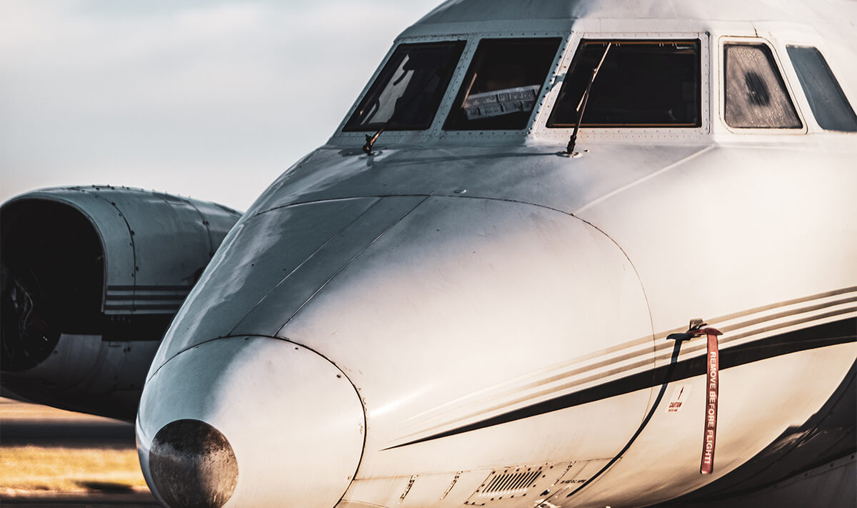 Older Private Jet in Field